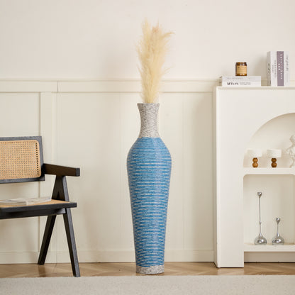 Blue and gray 39-inch floor vase decor with pampas grass, adding a stylish touch to a neutral-toned living room setting.