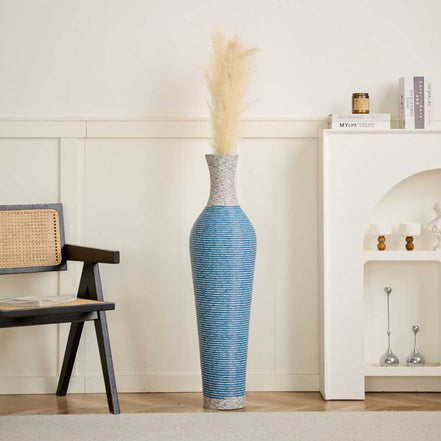 Blue and gray 39-inch floor vase decor with pampas grass, adding a stylish touch to a neutral-toned living room setting.