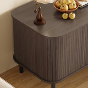 Close-up of the curved corner design and wood grain finish of the cat litter box enclosure with storage and charging station.