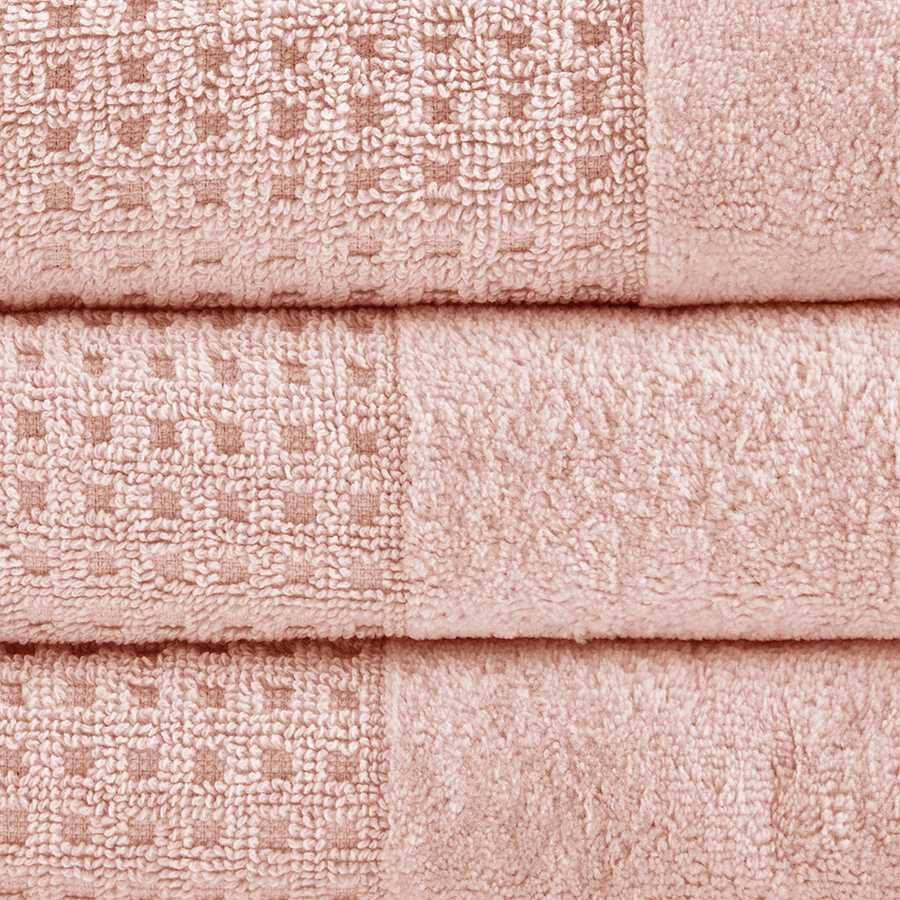 Close-up of pink Cotton Antimicrobial Bath Towels showing jacquard waffle weave texture and high-quality cotton fabric.