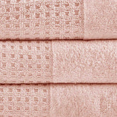 Close-up of pink Cotton Antimicrobial Bath Towels showing jacquard waffle weave texture and high-quality cotton fabric.