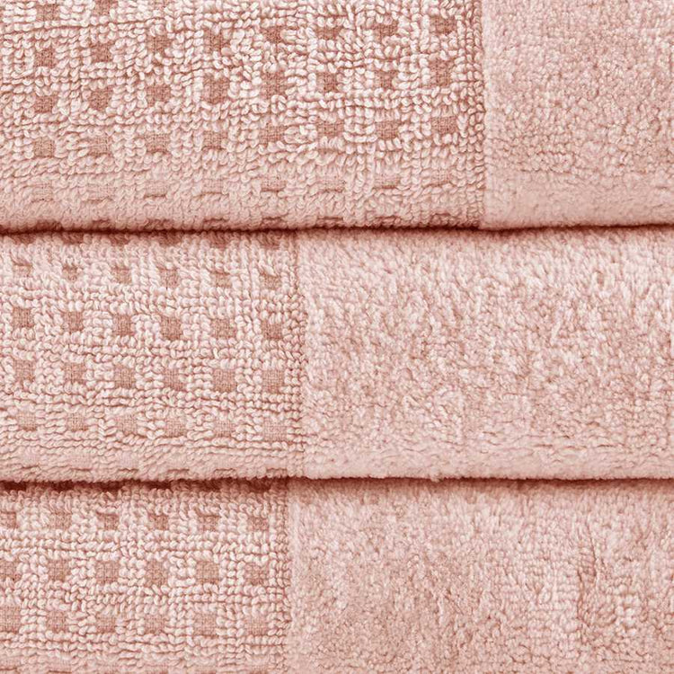 Close-up of pink Cotton Antimicrobial Bath Towels showing jacquard waffle weave texture and high-quality cotton fabric.