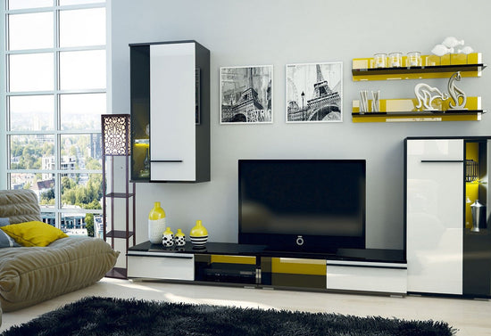 Modern living room with a television and decorative shelves.