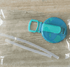 Blue lid with a straw holder and two straws on a wooden surface