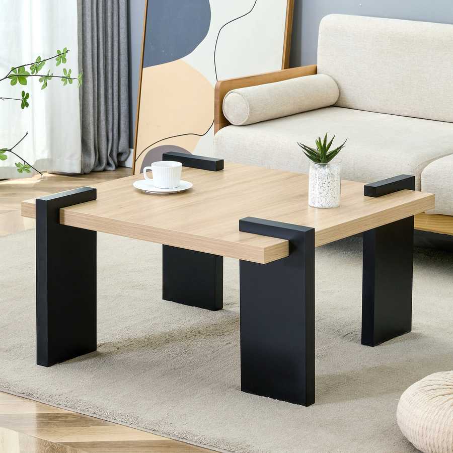 Minimalist MDF Coffee Table in modern living room, showcasing its clean lines and black leg accents for a sleek furniture upgrade.