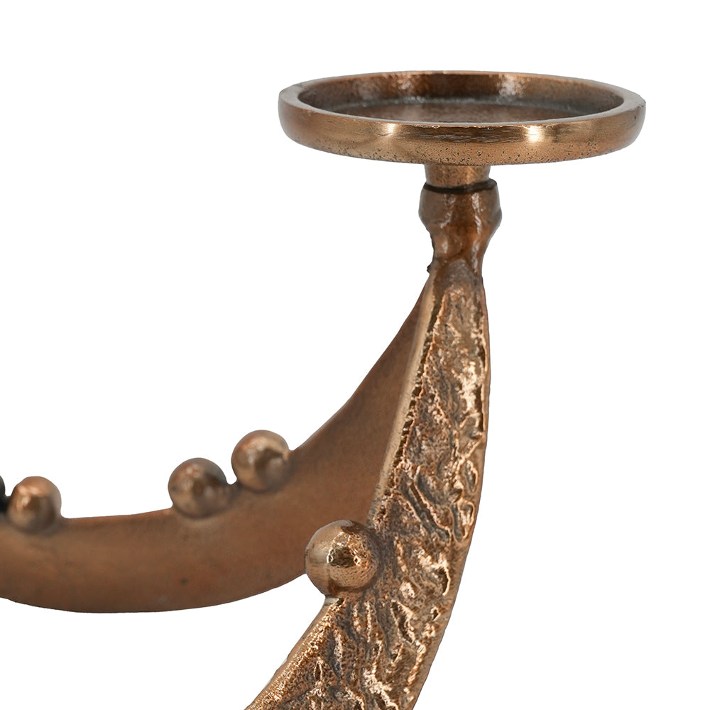 Close-up of a bronze metal wall sconce with a textured leaf-like arm, decorative raised studs, and a circular top cup holder, shown on a plain white background.