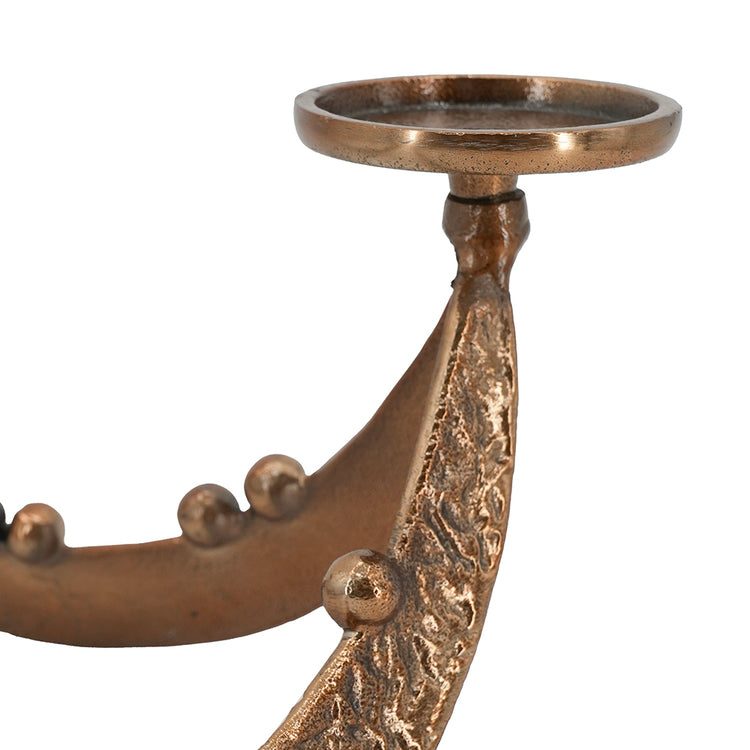 Close-up of a bronze metal wall sconce with a textured leaf-like arm, decorative raised studs, and a circular top cup holder, shown on a plain white background.