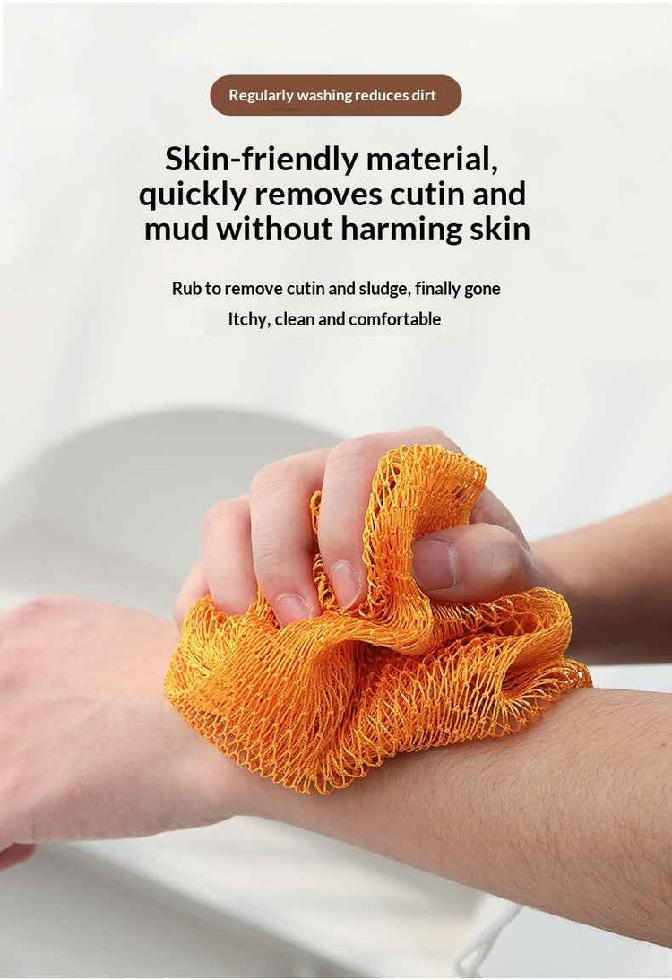 An orange mesh body washcloth being used on a person&