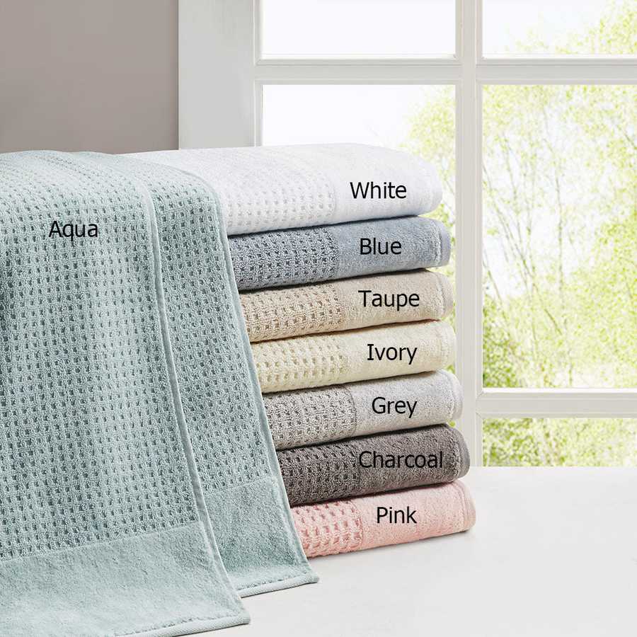 Cotton Antimicrobial Bath Towel Set in eight colors including aqua, white, blue, taupe, ivory, grey, charcoal, and pink, stacked by a window.