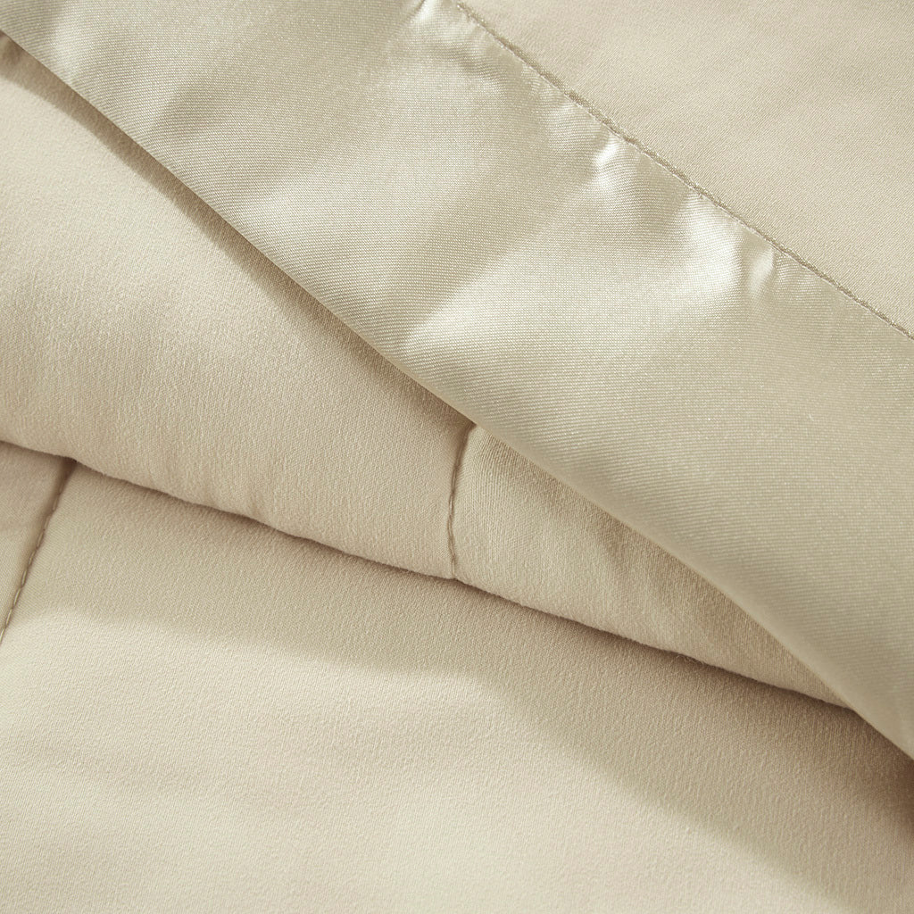 Close-up of Down Alternative Blanket Twin Cream showing soft texture and satin trim for a luxurious, hypoallergenic bedding experience.