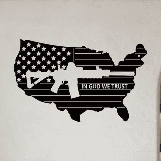 American flag iron wall art shaped like the USA with rifle silhouette and 'In God We Trust' text, ideal patriotic wall decor for home or office.