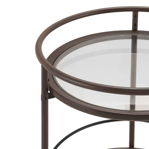 Round glass table with bronze metal frame on a white background