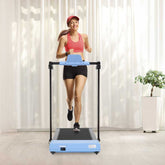 Woman running on treadmill with LED screen in home setting