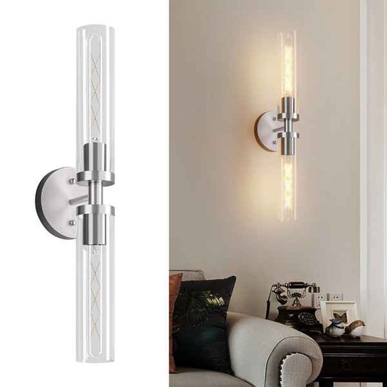 Modern brushed nickel bathroom sconces set of two with cylindrical glass shades and LED filament bulbs, ideal for vanity lighting