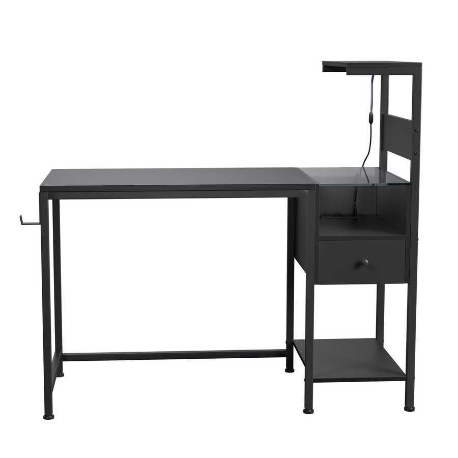 Minimalist black computer desk with built-in power outlet, USB ports, drawer, and reversible shelving for home office use.