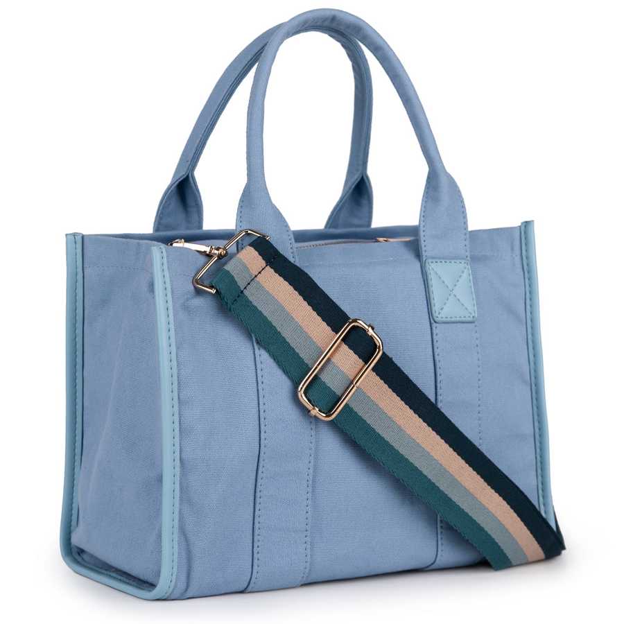 Blue tote bag with a striped shoulder strap on a white background