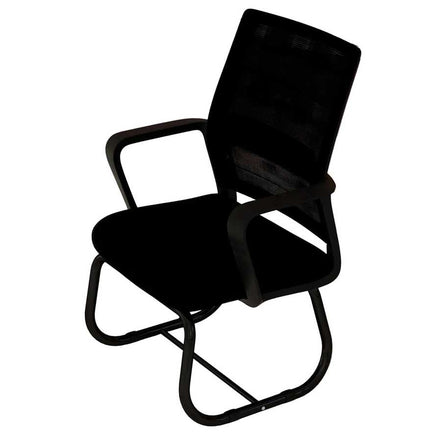 Black office chair in a room with red cabinets and a white rug.