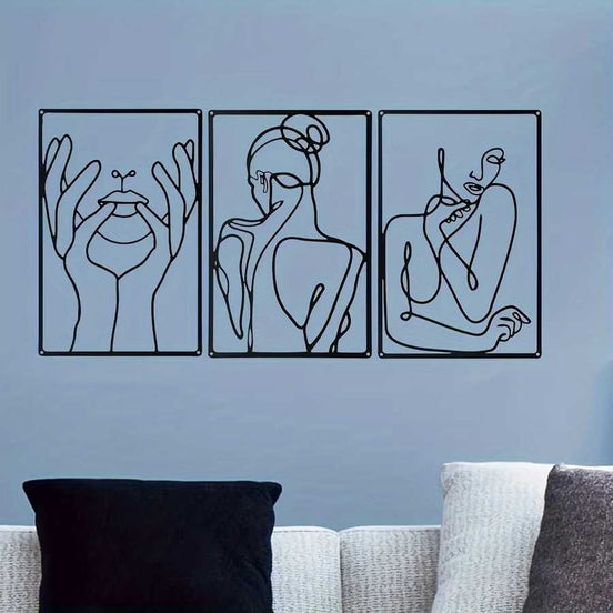 Abstract metal wall art set of 3 with black line art on a blue wall above a couch, perfect for stylish home or garden decoration.