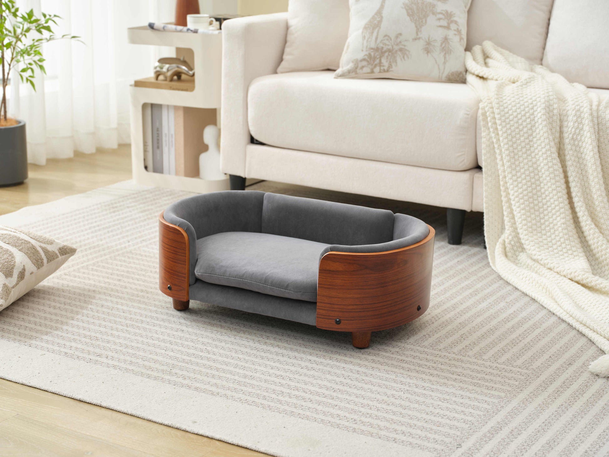 Side angle of Scandinavian Elevated Dog Bed with plush velvet cushion and curved solid wood frame for small pets.