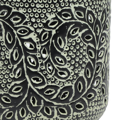 a black and white vase with a design on it