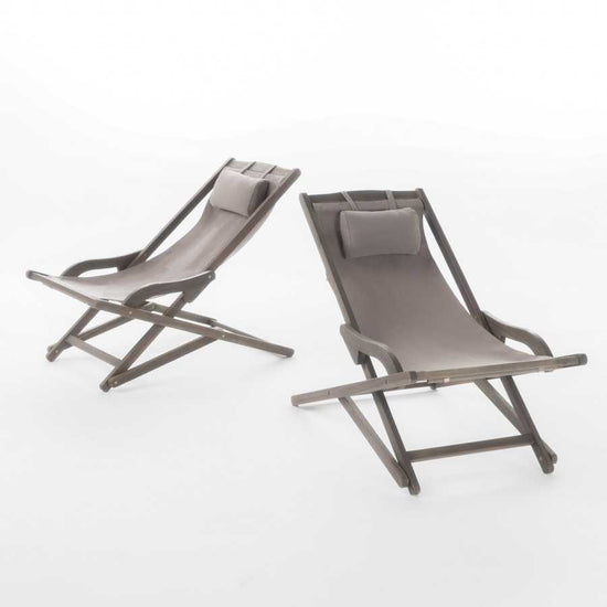 Outdoor sling chairs with pillows for relaxation