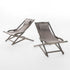 Outdoor sling chairs with pillows for relaxation
