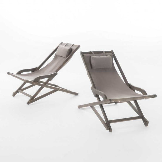 Two brown deck chairs on a white background