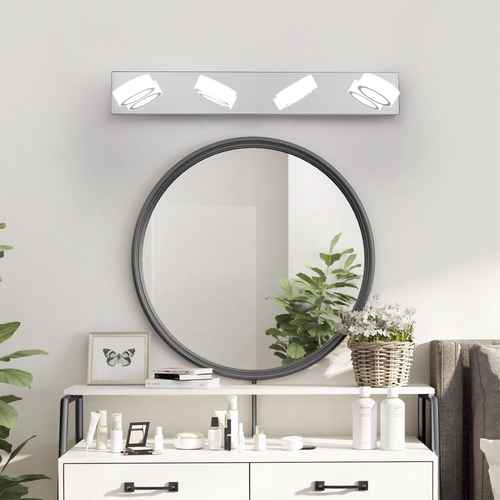 Round mirror with LED light bar above on a white wall with decorative items below.