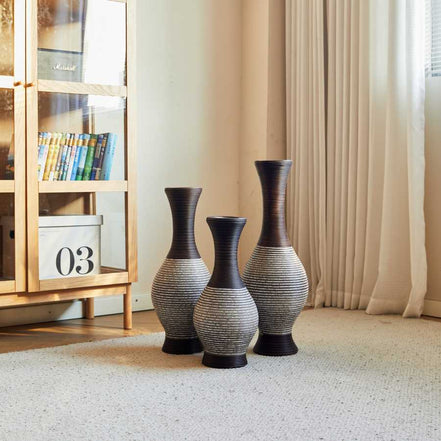 Brown floor vase set of 3 in a sunlit room corner, ideal for displaying dried flowers and elevating modern home aesthetics.