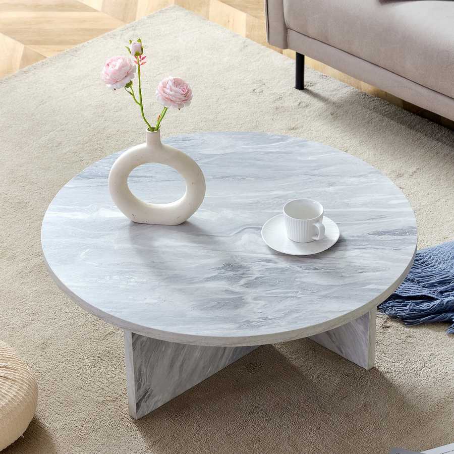 Top view of MDF white round coffee table with Nordic flair, styled with minimalist decor for a modern interior look.