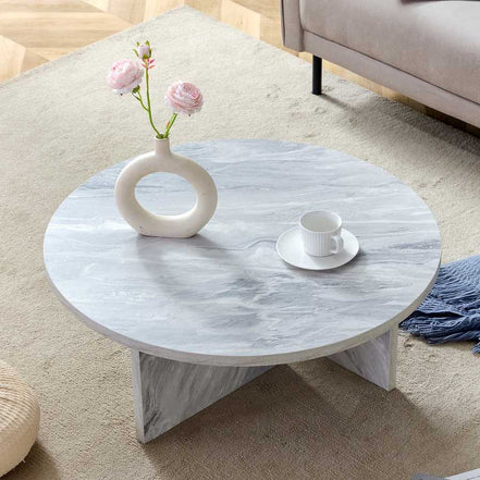 Top view of MDF white round coffee table with Nordic flair, styled with minimalist decor for a modern interior look.