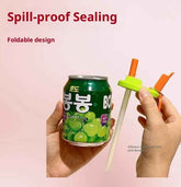 Person holding a can with a spill-proof sealing device on a pink background