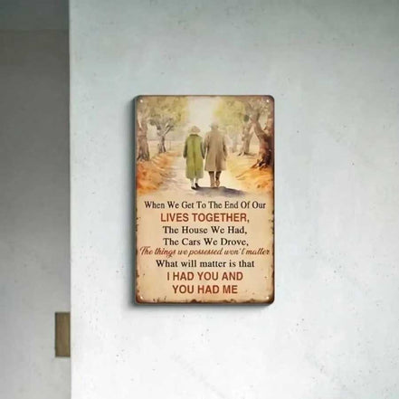 Metal wall art with sentimental quote displayed on a minimalist white wall, enhancing vintage-themed home decor.