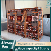 Patterned storage bag with handles on a couch, labeled for moving and home organization.