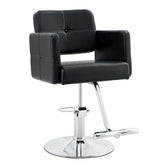 Black leather barber chair with chrome accents