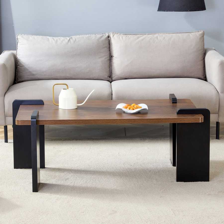 Front view of Walnut MDF Coffee Table in a modern living room setup, emphasizing its minimalist design and sturdy black leg construction.