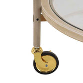 Close-up of a gold caster wheel on a white background