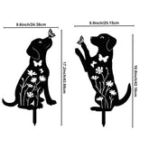 Dimensions of two black dog-shaped garden stakes with floral and butterfly designs on a white background.