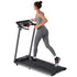 Woman running on foldable treadmill with digital display