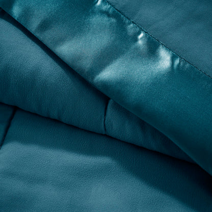 Close-up of Teal Twin Down Alternative Blanket showing soft microfiber texture and satin trim for luxurious bedding appeal.