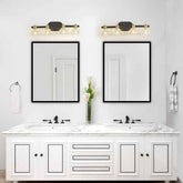 Bathroom vanity with double sink, mirrors, and wall lights.