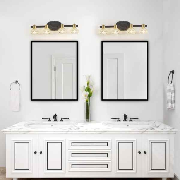Bathroom vanity with double sink, mirrors, and wall lights.