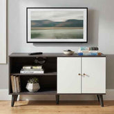 Stylish black and white wood TV stand with open shelves, cabinet doors, and angled legs, perfect for living room decor