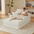 Woman sitting on a modern white lounge chair in a cozy living room.