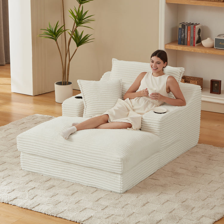 Woman sitting on a modern white lounge chair in a cozy living room.