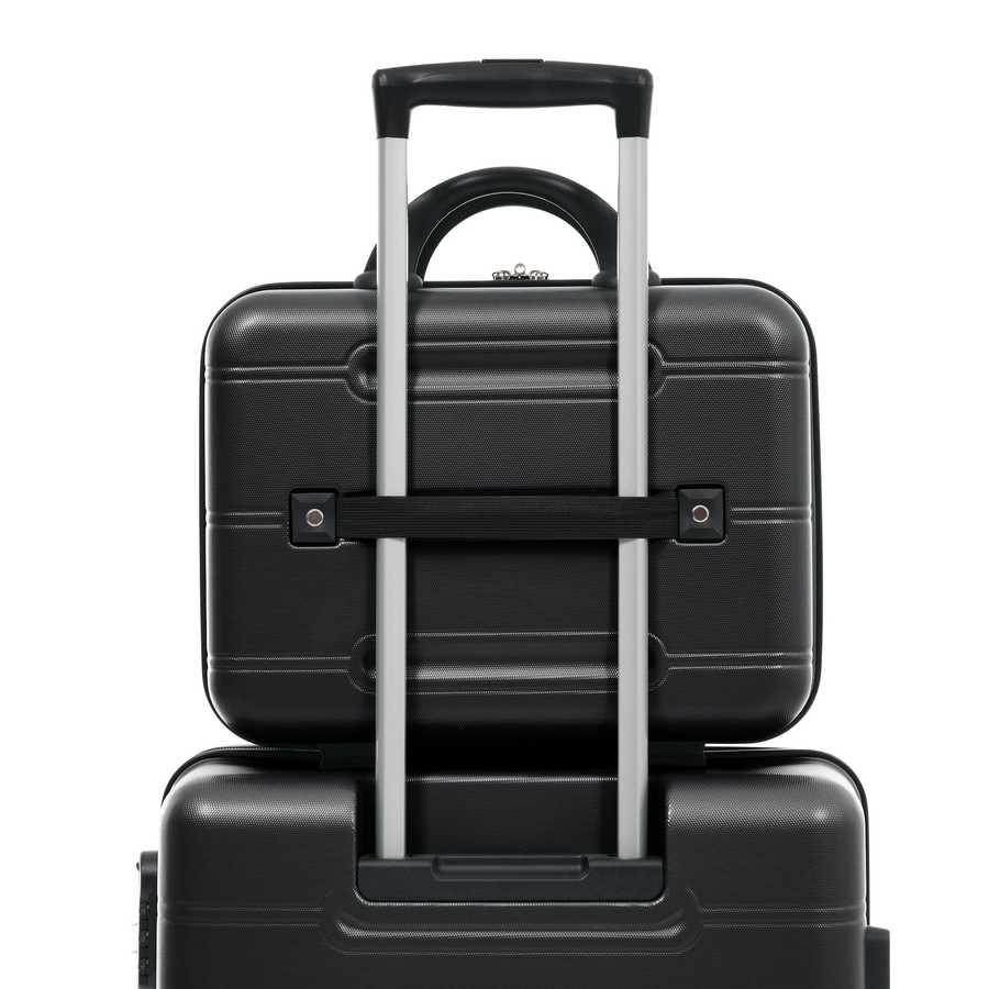 Two black suitcases stacked on top of each other with a white background