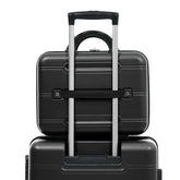 Two black suitcases stacked on top of each other with a white background