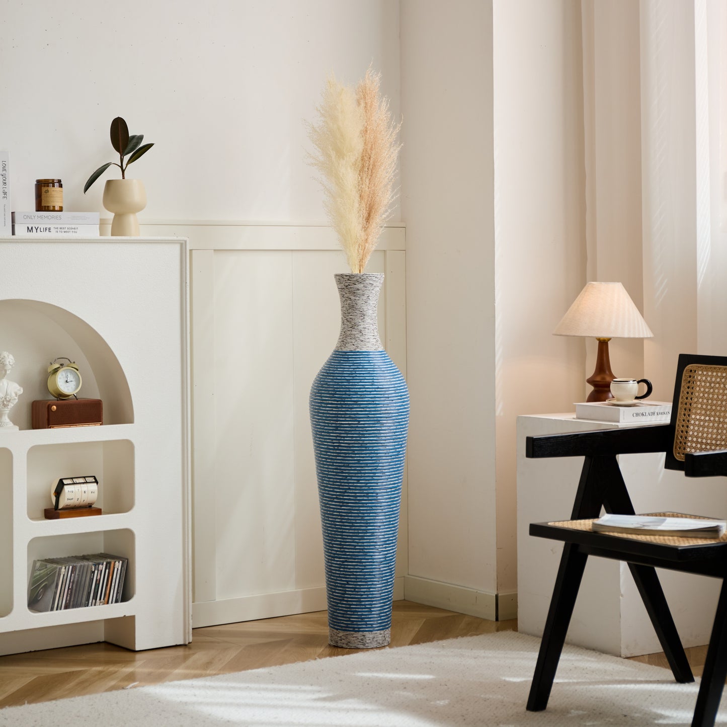 Tall 39-inch floor vase decor placed in a cozy bedroom corner, enhancing the space with its sleek blue and white PVC finish.