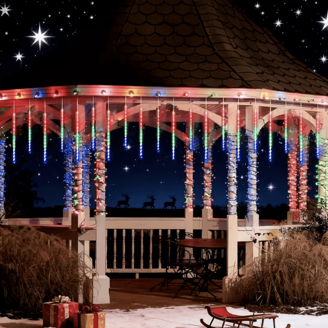 Gazebo trimmed with colorful meteor shower lights on a snowy night