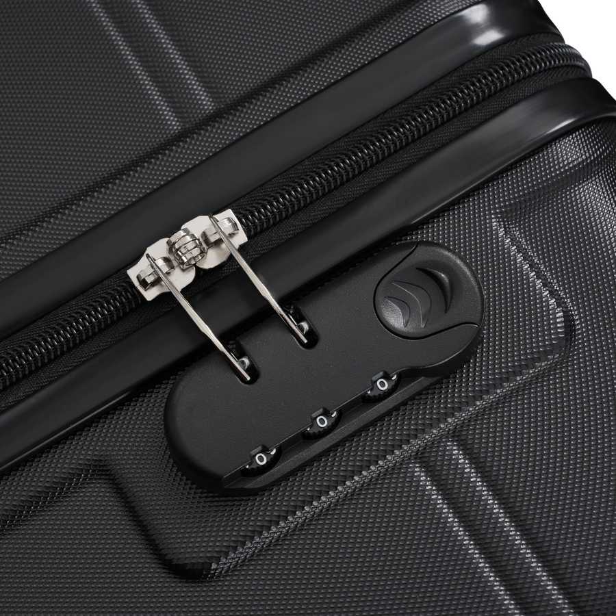 Close-up of a black suitcase with a silver zipper and a black tool attached.